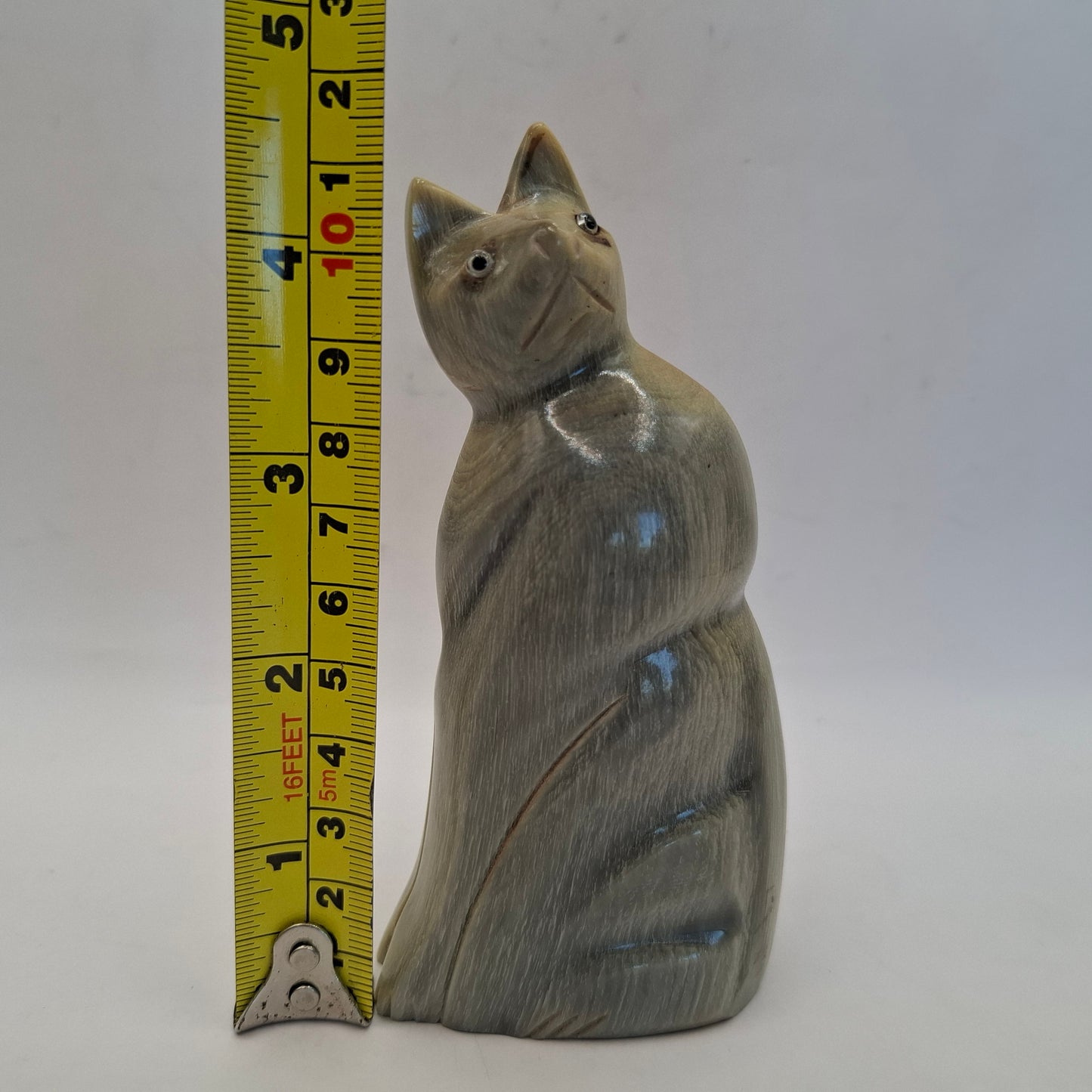 Horn Carving Of A Creepy Cat