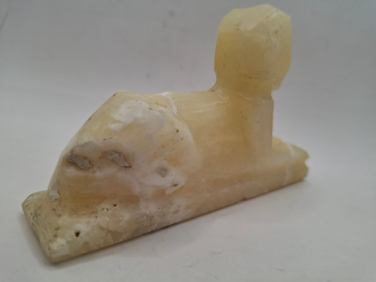 Battered Sphinx Carving