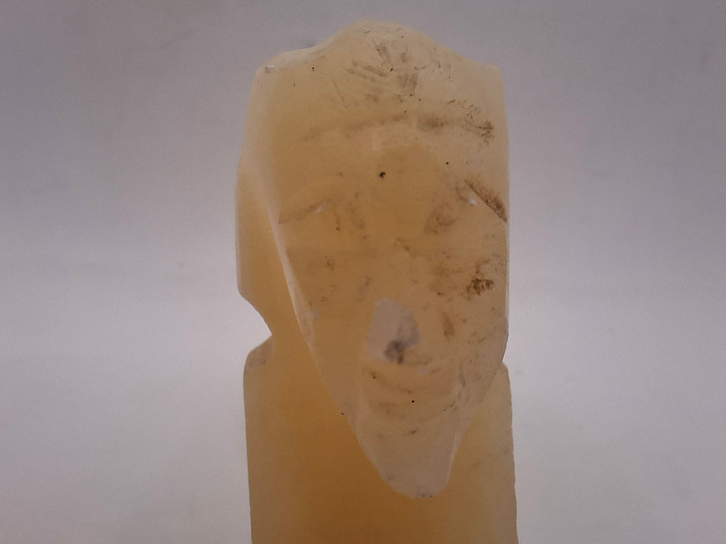 Battered Sphinx Carving