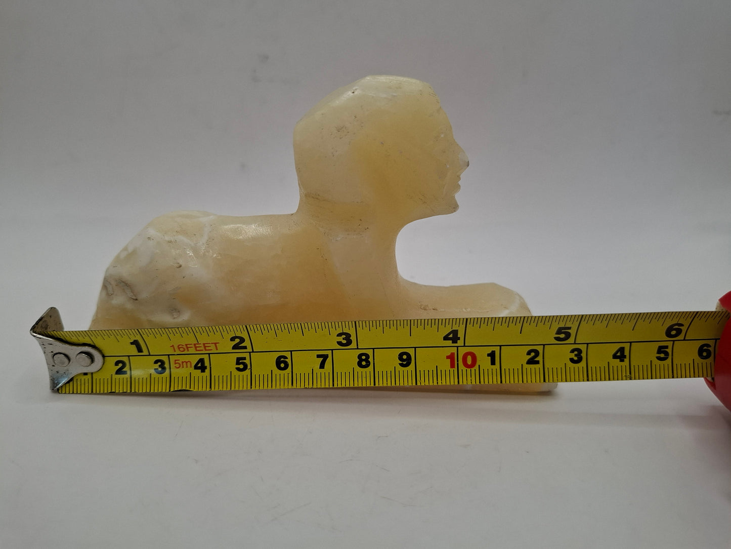 Battered Sphinx Carving