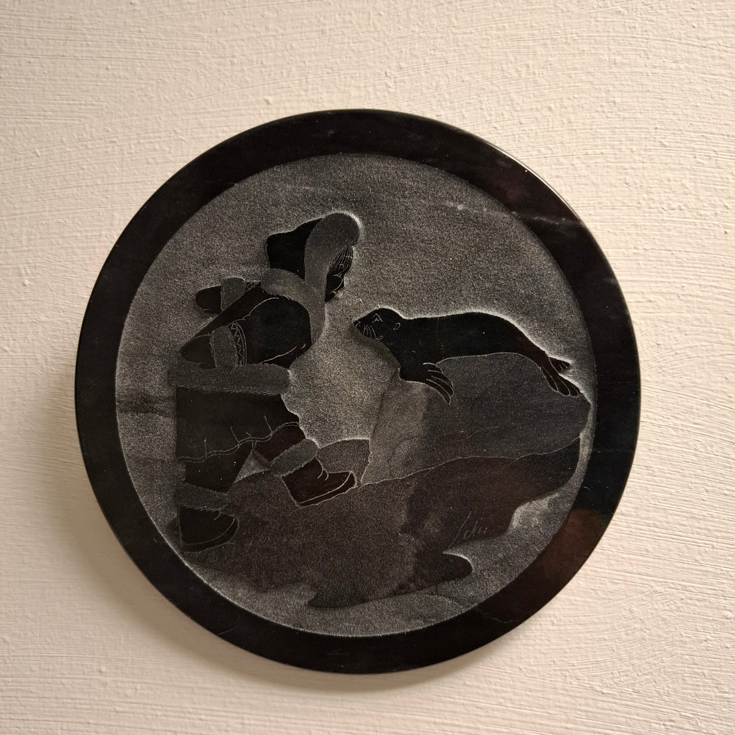 Carving of Fella with a Seal