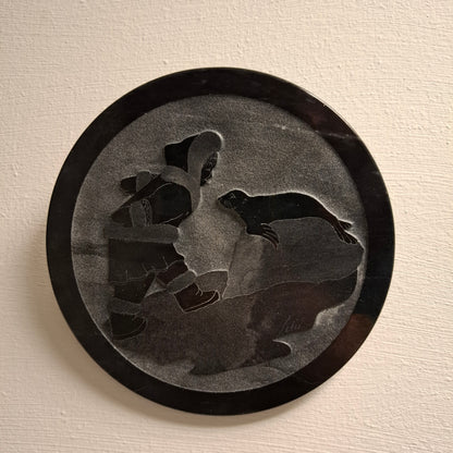 Carving of Fella with a Seal