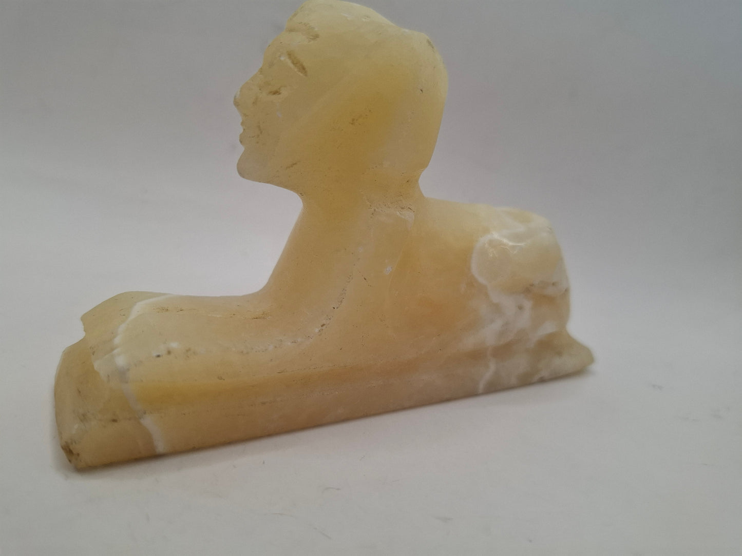 Battered Sphinx Carving