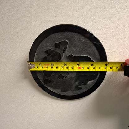 Carving of Fella with a Seal