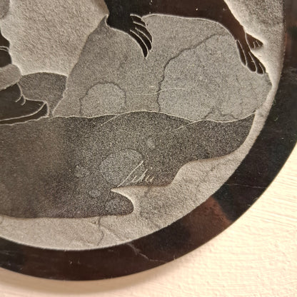 Carving of Fella with a Seal